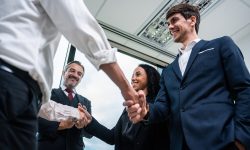 Caucasian businessman making a handshake together while stand in
